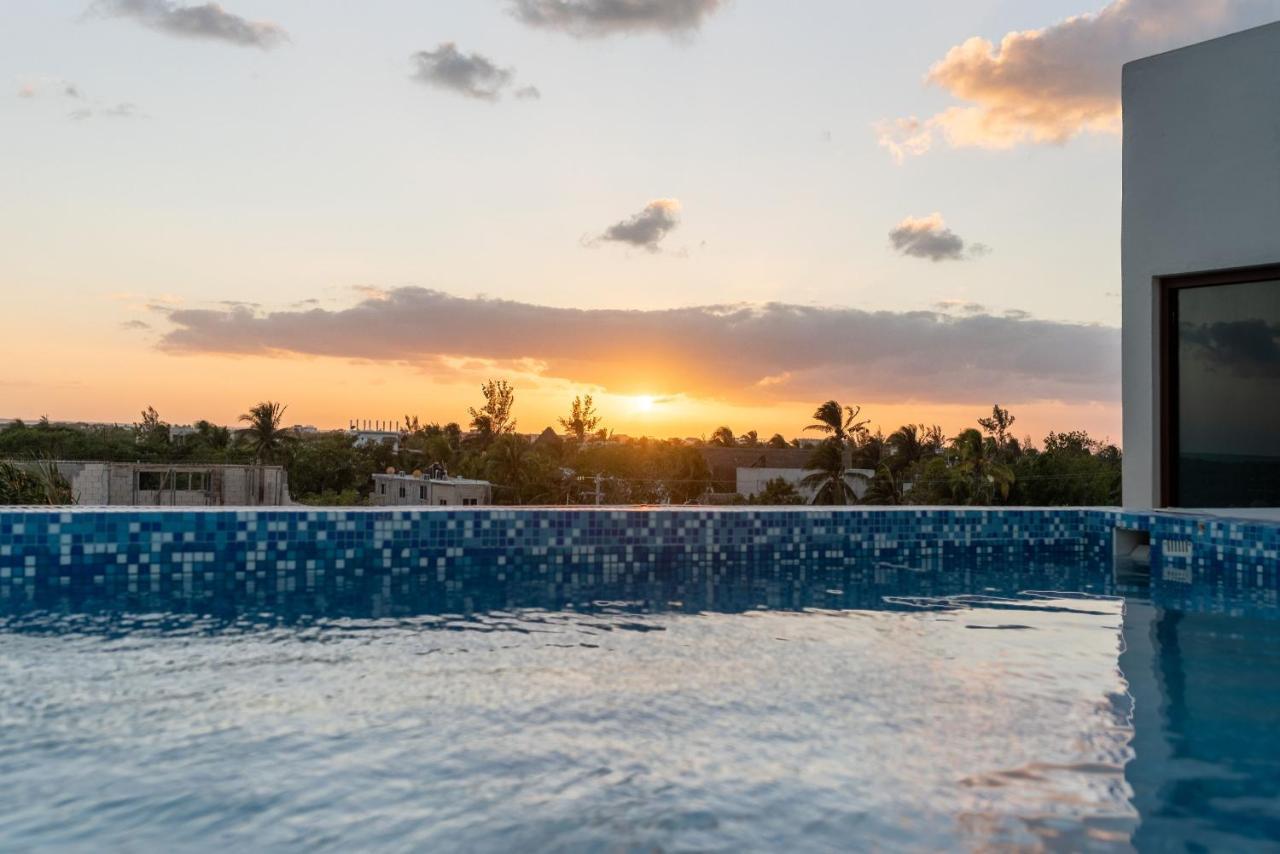 Hotel Mayari Holbox Exterior photo Sunset at the rooftop pool